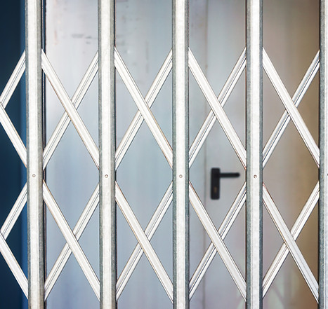 Roller shutters closed across a shop frontage